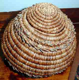 Coiled basket of pine needles and raffia, by Nancy Latham