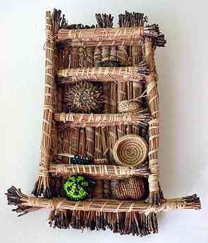 Tiny pine needle shelf, filled with miniature coiled baskets, by Nancy Latham