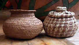 Leigh Adams first pine needle button basket, at right, shown with a Tarahumara plaited pine needle basket, photo by Leigh Adams