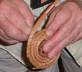 Bill demonstrates on a student's basket