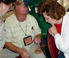 Bill demonstrates on a student's basket